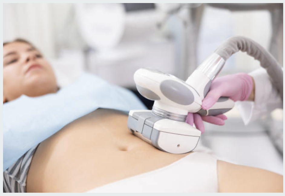 Woman receiving non-invasive body contouring treatment on abdomen with modern device
